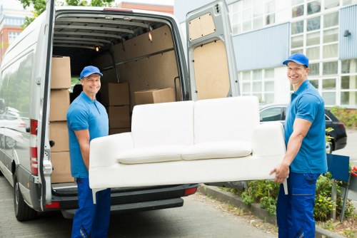 Professional packing team preparing household items in Holland Park