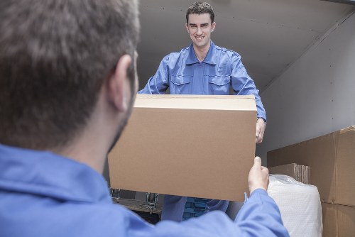 Removal team planning a flat move in Holland Park near period apartment buildings