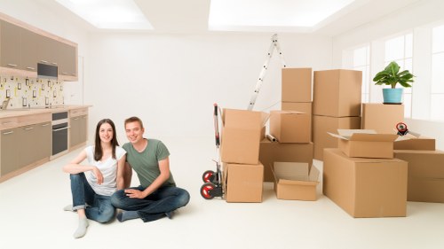 Packed boxes and furniture ready for a residential move in Holland Park