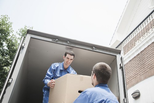 Packed office equipment prepared for a business move in West London