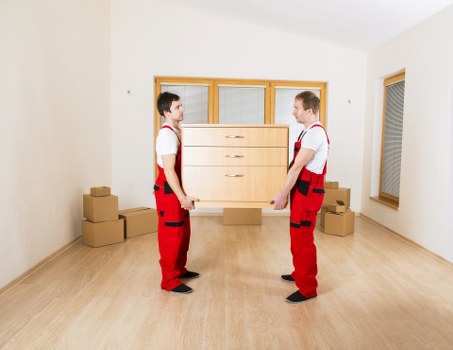Professional movers loading belongings for a same-day relocation near Holland Park